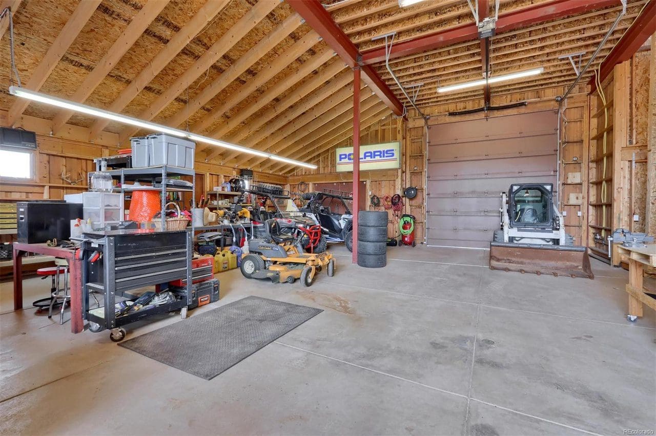 A garage with many different types of vehicles in it.