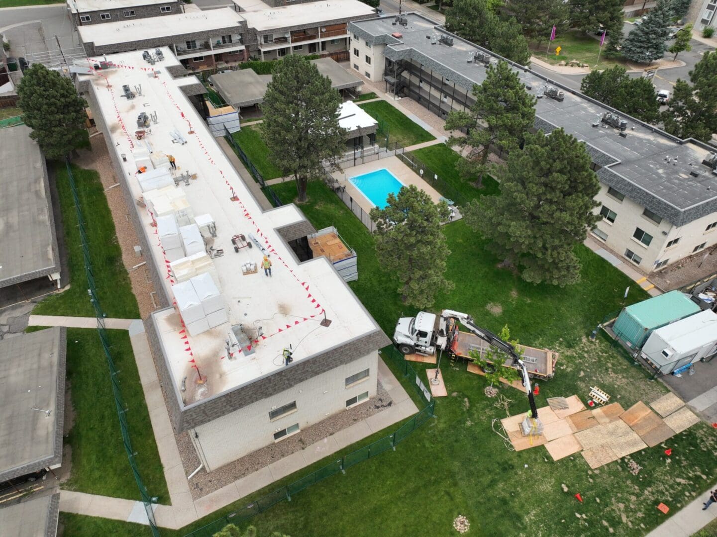 aerial view of building being constructed with swimming pool