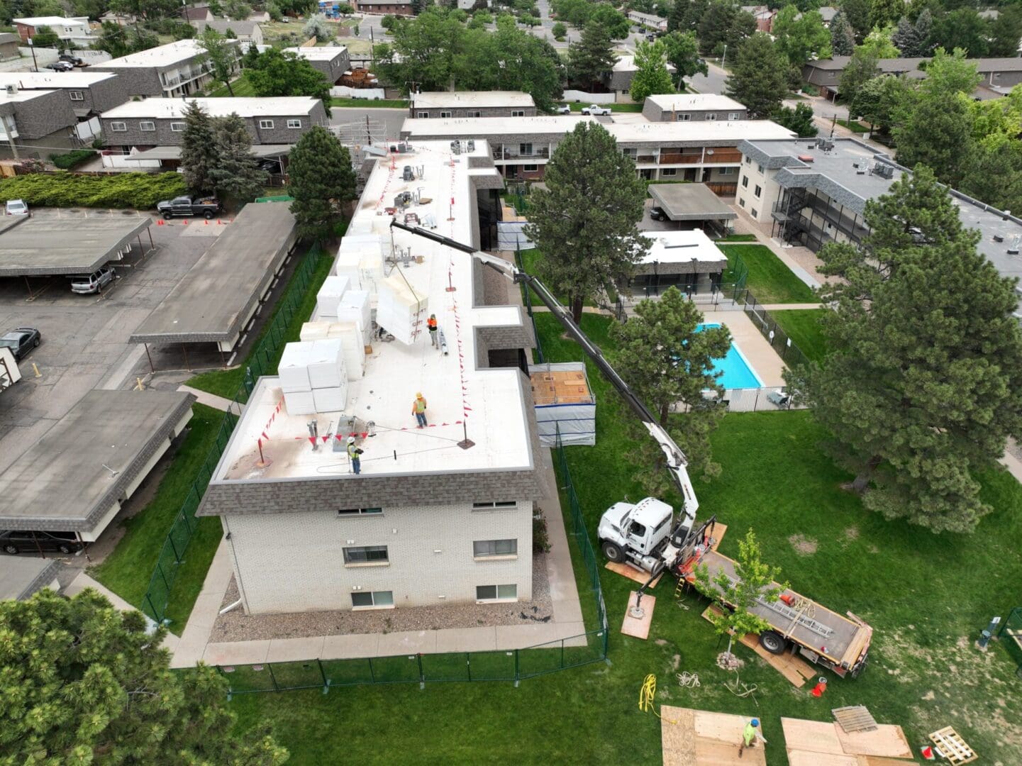 rooftop view of building being constructed with red flags 4
