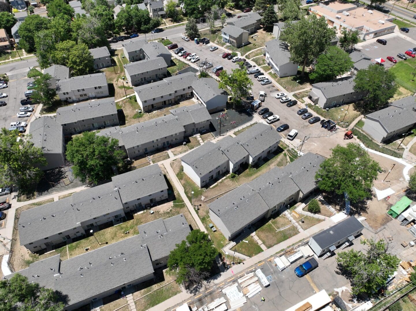 aerial view of subdivision with houses and cars 2